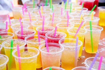 Colorful soft drink in plastic cup - 285599501