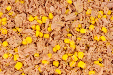 Flaked tuna fish and sweet corn background