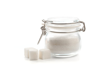 glass can with clasp full of sugar isolated  on white