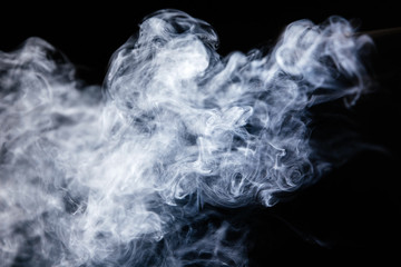 Grey smoke waves on black background