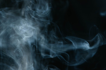 Grey smoke waves on black background