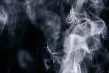 Grey smoke waves on black background