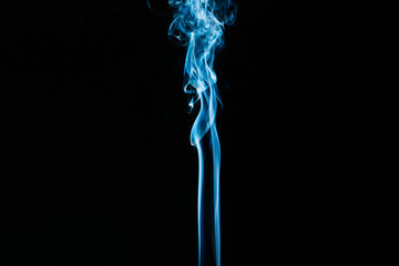 Blue wavy smoke on black background