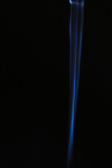 Blue wavy smoke on black background