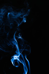 Blue wavy smoke on black background