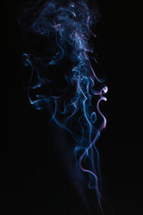 Blue wavy smoke on black background