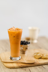 Bubble milk tea with bubble topping for tea or other beverage on the wood table with copy-space for textures and wall Natural light background