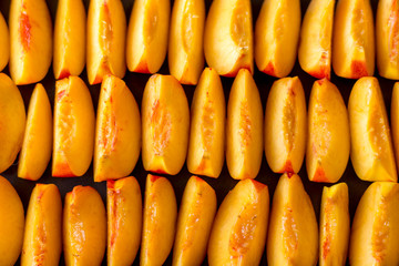 Peach slices or wedges in rows