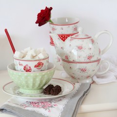 Tea set on a white table.