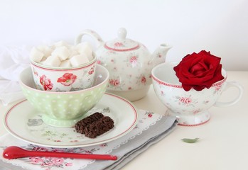 Tea set on a white table.