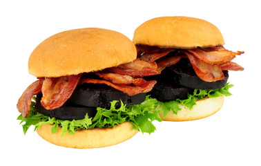 Fried bacon and black pudding sandwich rolls with lettuce isolated on a white background