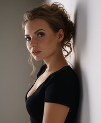 Fototapeta premium Studio photo of nice young brunette in black dress