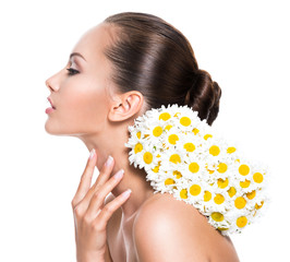  beautiful woman with posy flowers touching neck