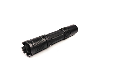 black long flashlight isolated on white background.