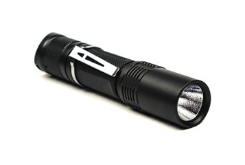 black long flashlight isolated on white background.