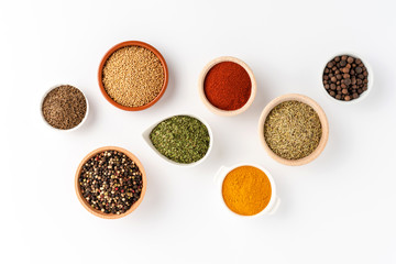 Collection of spices isolated on white background. Top view - Powered by Adobe