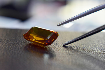 Yellow gemstone is a natural gemstone that has been cut through Is an expensive gem