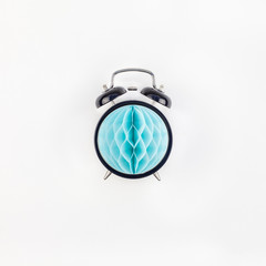 Fototapeta premium Black alarm clock with blue paper ball concept