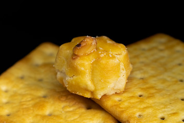 Cracker cookies on dark background.