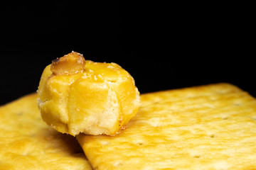 Cracker cookies on dark background.