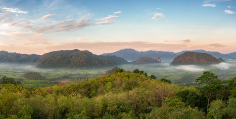 Beautiful scenery of Bantat mountain range and forest with some thin mist flowing in early morning, Phatthalung province, southern of Thailand.