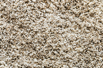 carpet high pile of threads of different thickness and weaving. Shaggy carpet background