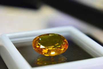 Yellow gemstone is a natural gemstone that has been cut through Is an expensive gem