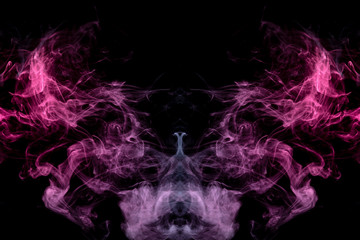 Smoke of different blue, red and pink colors in form of horror in the shape of the head, face and eye with wings on a black isolated background. Soul and ghost in mystical symbol. Print for clothes.