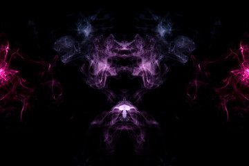Smoke of different blue, red and pink colors in form of horror in the shape of the head, face and eye with wings on a black isolated background. Soul and ghost in mystical symbol. Print for clothes.