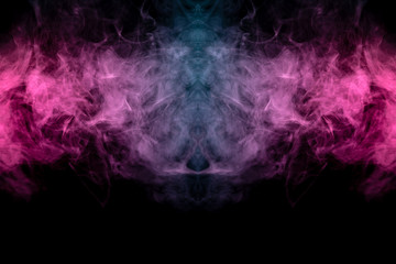 Smoke of different blue, red and pink colors in form of horror in the shape of the head, face and eye with wings on a black isolated background. Soul and ghost in mystical symbol. Print for clothes.