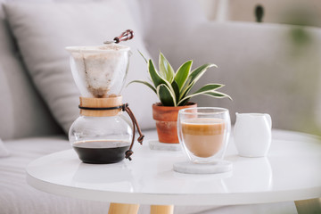 Breakfast with chocolate cake and coffee served on a beautiful living home