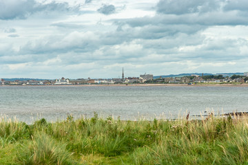 Fototapeta premium Greenan Bay Low Tide to the Town of Ayr in the Far Distance