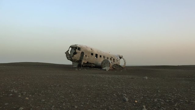 Silhouette of a crashed U.S. Navy DC-3 on the black sands of Solheimasandur, Iceland.