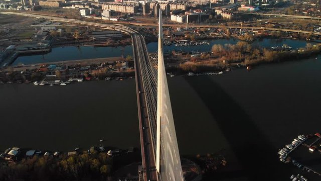 An aerial hyper-lapse view of the famous Ada bridge in Belgrade, Serbia at winter