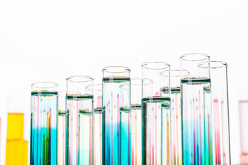 Glass laboratory chemical test tubes with liquid for analysis close up