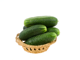 Cucumbers in a basket on a white background