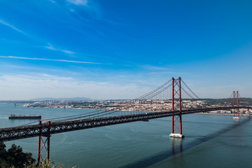Obraz premium The 25 April Bridge, Lisbon, the Tejo river, Portugal