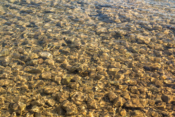 Pebbles in a shallow sea water