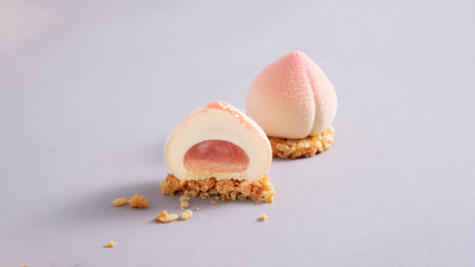 Peach cupcakes in the shape of peaches on a cracker