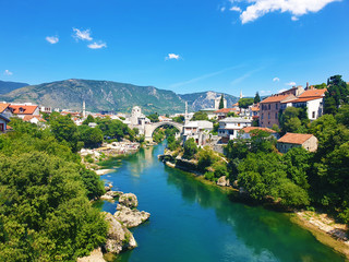Fototapeta na wymiar Mostar Bridge (Stari Most) With Surrounding Town
