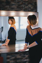 Woman looking in the mirror