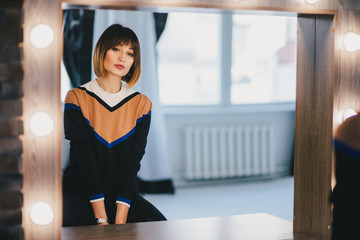 Woman looking in the mirror