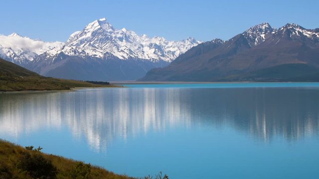Mt Cook with beautiful water reflection on lake Pukaki in Aoraki Mt Cook national park, New Zealand. New Zealand nature and landscape in Mt Cook.