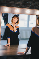 Woman looking in the mirror