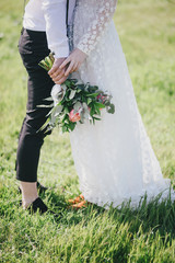 Bride and groom feet close up. Rustic wedding concept.