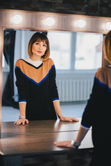 Woman looking in the mirror