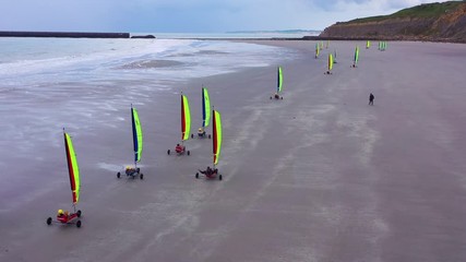 Aerial land carts sail carts blokarts sand yachts are sailed on the beach in France.