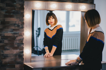 Woman looking in the mirror