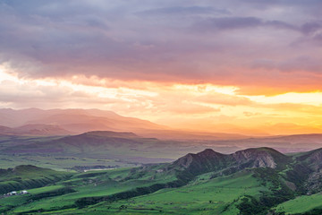 Fototapeta na wymiar Beautiful Georgian countryside at the end of spring at sunset