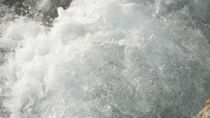 Slow motion sea waves crashing. Close-up shot.